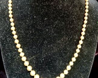 Jewelry Lot 4000-P.  $32.00. One 17" pearl necklace, with graduated size pearls, each tied, and two pairs of pearl cluster earrings, one clip-ons and one screw-ons.  The necklace pearls feel gritty to the tooth, the earrings do not but this is a lovely set and perfect as a gift for the pearl lover.  All are vintage.  Earrings are clip-on and 1-3/4" drop, and the screw-ons are just over an inch wide.  