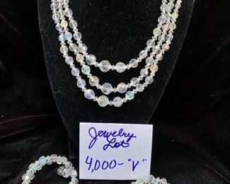 Jewelry Lot 4000-V.  $120.00. Aurora Borealis Faceted Glass Clear Crystal Necklace set, 3 strands, 1 pair of round 1-1/4" clear crystal earrings, and 2 Awesome Wrap-Around clear crystal bracelets.  