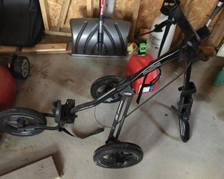 Golf bag stand and miscellaneous tools.