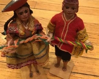 1972 Peru handmade dolls with wooden base, hand painted face, wool clothing       9” tall.     pair $25