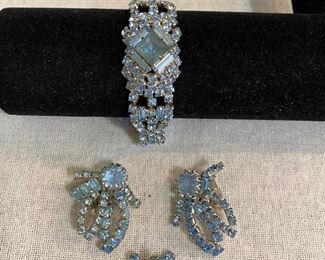 Matching costume jewelry set. Bracelet, clip earrings and brooch. Aqua marine stones and silver colored settings. All in mint condition with no missing stones and good clasp. Unmarked. $35