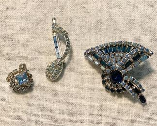 Vintage pin brooch aqua marine/blue stones set in silver tone, music note pin missing some stones, one screw on earring with stones. Lot of (3) $15