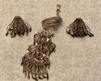 Vintage set of screw on earrings and peacock brooch pin. Unmarked gold tone filigree. $12