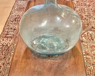$75 - Vintage large glass bottle 18 1/2 in. (H) x 14 in. (W); 9 1/2 in. (Diameter of base)