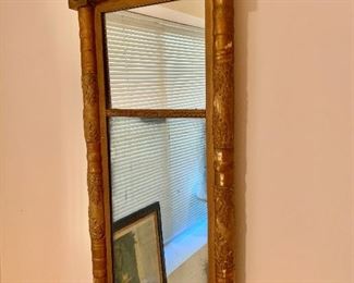 $95 - Antique framed mirror with leaf decorations; 31 1/2 in. (H) x 15 1/2 in. (W)