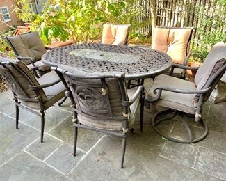 $275  - Patio set.  Table and six chairs with cushions.  Table 28"H x 39.5"W x 65"L; Chairs 36"H x 27"D x 24"W (height to seat 19"H)