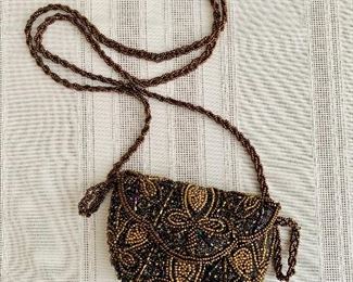 Neiman Marcus beaded cocktail bag; 3 1/4 in. x 4 1/2 in. with 26 in. strap length