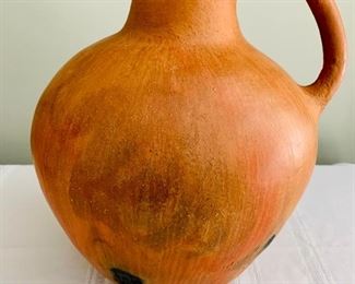 $40 - Clay pitcher with single handle; 14 in. (H) x 11 in. (W)