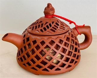 $25 - Reticulated "fish basket design" teapot; 3 in. (H) x 5 in. (W)