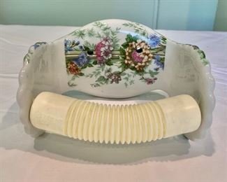 $30 - Floral toilet tissue holder; "Porcelain de Paris, France"; 3 1/2 in. (H, wall attachment) x 6 1/2 in. (W) x 4 1/2 in. (W)