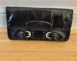 $40; Cole Haan black leather clutch; 10” w x 6” h; dust cover included