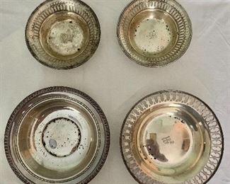Assortment of four sterling candy dishes all approx. 1 in. (H); two smaller with monogram "RM" 4 3/4 in. (diameter); other two approx. 6 in. (diameter)-one with initial "M"