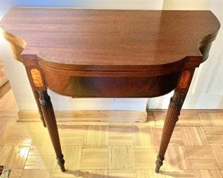 $175 - Gateleg bow front table with fluted legs; 35” W x 17” D x 30” H.  34” deep when open.