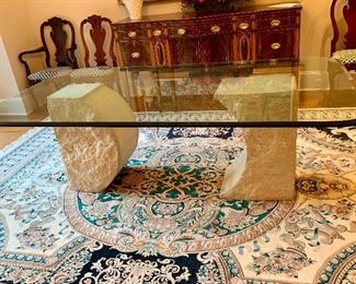 Sculptured stone base with 7β4β by 4β glass top table
