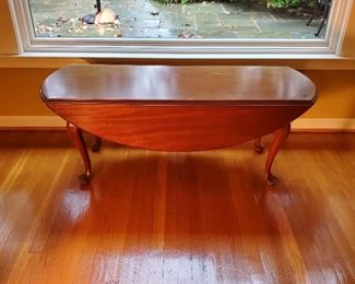 $95 - double drop leaf coffee table: 19" high x 47" long x 16" wide when sides are down; 35" wide when both sides are up