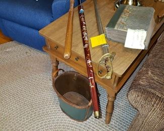 The Cane in the Middle is a Pool Que...Asian Pictures on the Cane. Looks like there is a 'billy club' on the left. The album with the note sticking out of it...is a Antique Post Card Album filled with fantastic Antique Post Cards...1900-1920's. 