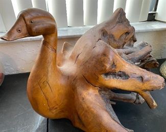 Carved duck from tree root