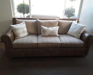 Elegant Thomasville brown leather sofa with upholstered cushions