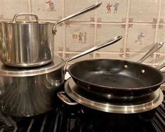 Item 293:  Lot of All-Clad pans - ones on left are teflon on inside - these pans are used: $65