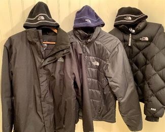 Item 473:  (3) North Face coats & (3) North Face hats:  Priced on-site (MIDDLE ONE SOLD)