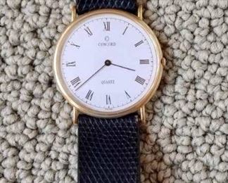Item 447:  Concord Quartz Mens 14 K Watch with Leather Band: $350