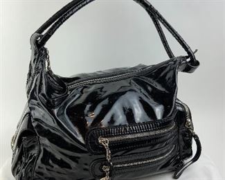 This Stella McCartney Black Patent Leather bag is available for purchase at:       https://scavengersparadiseestatesales.com