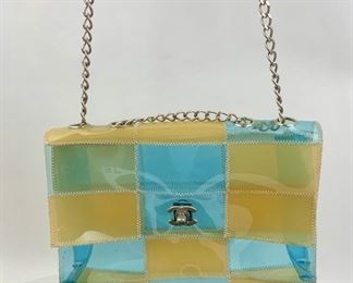 This Chanel Clear Patchwork bag is available for purchase at:       https://scavengersparadiseestatesales.com