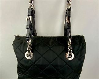 This Prada Black Quilted Nylon Tessuto bag is available for purchase at:       https://scavengersparadiseestatesales.com