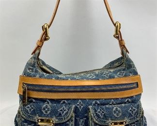 This Louis Vuitton Denim bag is available for purchase at:       https://scavengersparadiseestatesales.com