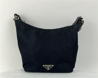 This Navy Prada Nylon & Leather Shoulder bag is available for purchase at:       https://scavengersparadiseestatesales.com
