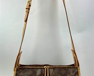 This Louis Vuitton Triangle Crossover bag is available for purchase at:       https://scavengersparadiseestatesales.com