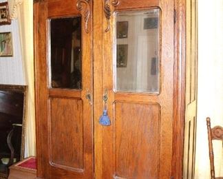95 - Oak two door wardrobe w mirror doors & carved crown w Brass pulls, 91 T, 53 W, 18 D