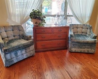 Pair of swivel occasional chairs and solid wood cabinet