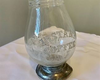 $25 - "Instant Coffee" etched glass container with sterling silver (Frank M. Whiting) base, AS IS; no screw top and multiple dents to silver base; 5 1/2 in. (H) x 3 1/2 in. (W)