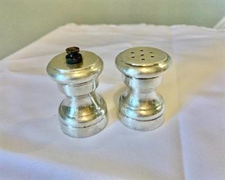 $120 - Tiffany & Co. sterling silver salt shaker and pepper mill; made in Italy; 2 1/4 in. (H) x 1 1/2 in. (diameter)