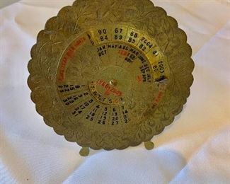 $20 - Brass perpetual calendar for 40 years; 4 3/4 in. (diameter)