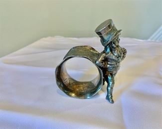 $95- Vintage napkin ring with young lad; unmarked; 3 1/2 in. (H) x 3 in. (W) x 2 in. (diameter ring)