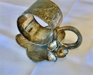 $35 - Silverplate lily pad napkin ring; 2 1/2 in. (H) x 3 1/2 in. (W) x 3 in. (depth)
