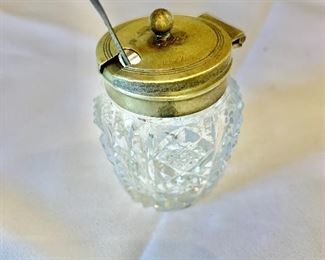 $15;  Mustard pot/jam jar with silverplate rim and sterling silver spoon; 2 1/4 in. (H) x 1 1/2 in. (diameter)