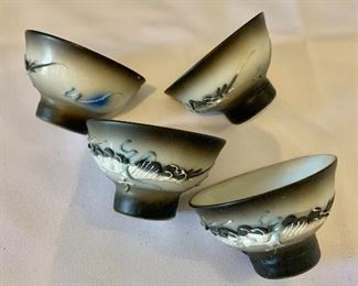 $16; Four sake cups with raised dragon: hand designed; 1 1/4 in. (H) x 2 in. (diameter)