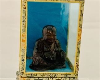 $35; Seated resin Buddha in covered display box; box dimensions, approx. 5 in. (H) x 3 in. (base); Buddha 2 1/2 in. (H) 
