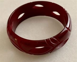 $20; Carved dark red bangle bracelet, 1" width, 3" diameter