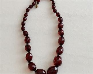 $10; Red plastic bead costume necklace4, 19.5" long