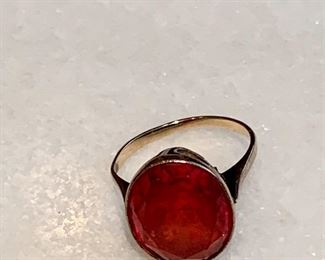 $80; Ring with red stone; stone is 5/8" x 1/2"; no hallmarks; mis-shapes; Ring approx size 5;  Likely scrap.