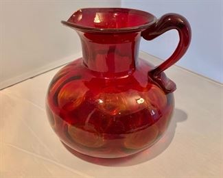 $20; Red blown glass pitcher (small); 6.25" H x 6" W