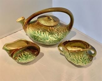 $50; McCoy green and brown tea set; teapot (6" H x 10" W x 6.5" D) with sugar bowl (3" H x 5.5" W x 4" D) and creamer (3" H x 5" W x 4" D)