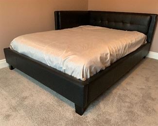 6. Full sized platform bed with leather sides.  Pillows included.  Mirror not for sale. $195