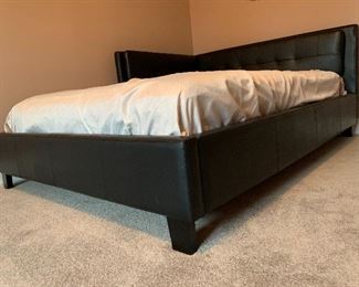 6. Full sized platform bed with leather sides.  Pillows included.  Mirror not for sale. $195