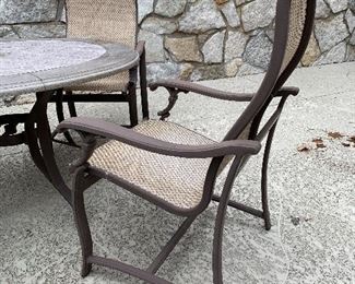 17. Patio set with faux stone top.  2 chairs are spinners and 2 have four legs.  Some wear to the material, but no holes or tears.  Looks great.  $195