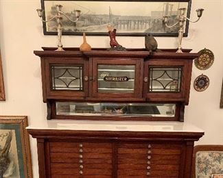 Turn of the century dental cabinet with marble top in fantastic condition. Would be the focal point in any home!